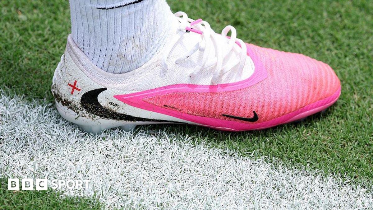 Why are footballers wearing pink boots at the World Cup?